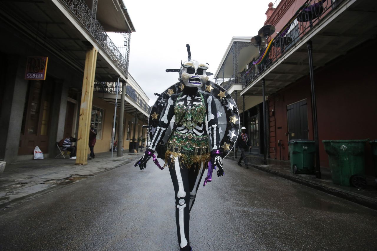 A member of the Skeleton Krewe walks through New Orleans' French Quarter on Tuesday.