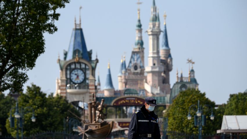 A security guard wearing a protective facemask is seen at the temporarily closed Shanghai Disney resort in Shanghai on February 23, 2020. - The coronavirus epidemic that has killed over 2,400 people is communist China's "largest public health emergency" since its founding, said President Xi Jinping on February 23. (Photo by NOEL CELIS / AFP) (Photo by NOEL CELIS/AFP via Getty Images)
