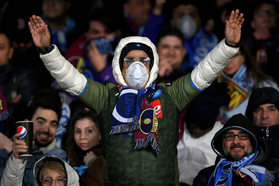 A Napoli supporter wears a mask during the Champions League tie against Barcelona. 