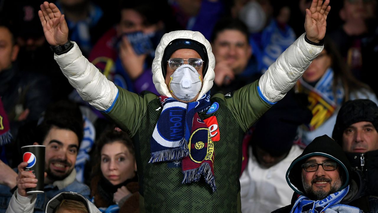 A Napoli supporter wears a mask during the Champions League tie against Barcelona. 
