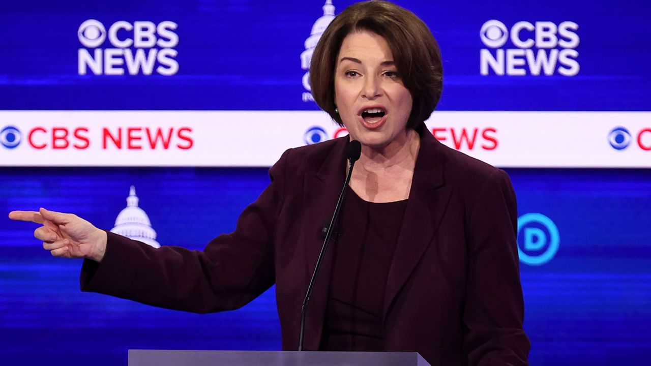 Democratic presidential candidate Sen. Amy Klobuchar (D-MN) speaks as former Vice President Joe Biden (L) and Tom Steyer (R) look on during the Democratic presidential primary debate at the Charleston Gaillard Center on February 25, 2020 in Charleston, South Carolina.