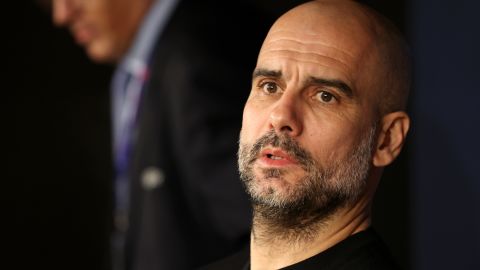 Pep Guardiola speaks with reporters ahead of Man City's round-of-16 tie against Real Madrid.