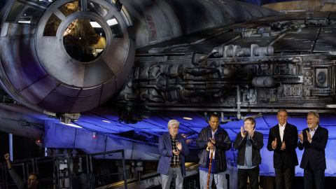 From left, Lucas, Billy Dee Williams, Mark Hamill,  Iger, and Harrison Ford stand in front of the Millennium Falcon during the unveiling of the Star Wars: Galaxy's Edge theme park area.