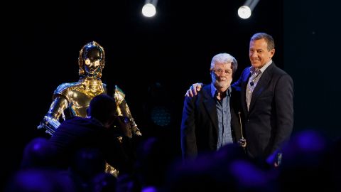 Lucas and Iger pose for a photograph at the D23 Expo in 2015.