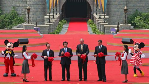 From left, Hong Kong Chief Executive Donald Tsang, Chinese Vice President Zeng Qinghong, Disney CEO Michael Eisner and CEO-elect Bob Iger attend the opening ceremony of Hong Kong Disneyland in 2005.