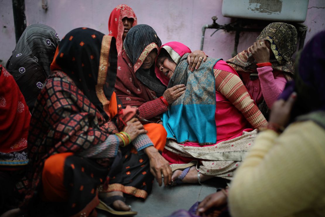 Family members mourn a relative killed in clashes.