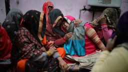 Family members of Rahul Solanki, who was killed during clashes between Hindu mobs and Muslims protesting a contentious new citizenship law, weep outside a mortuary in New Delhi, India, Wednesday, Feb. 26, 2020. 