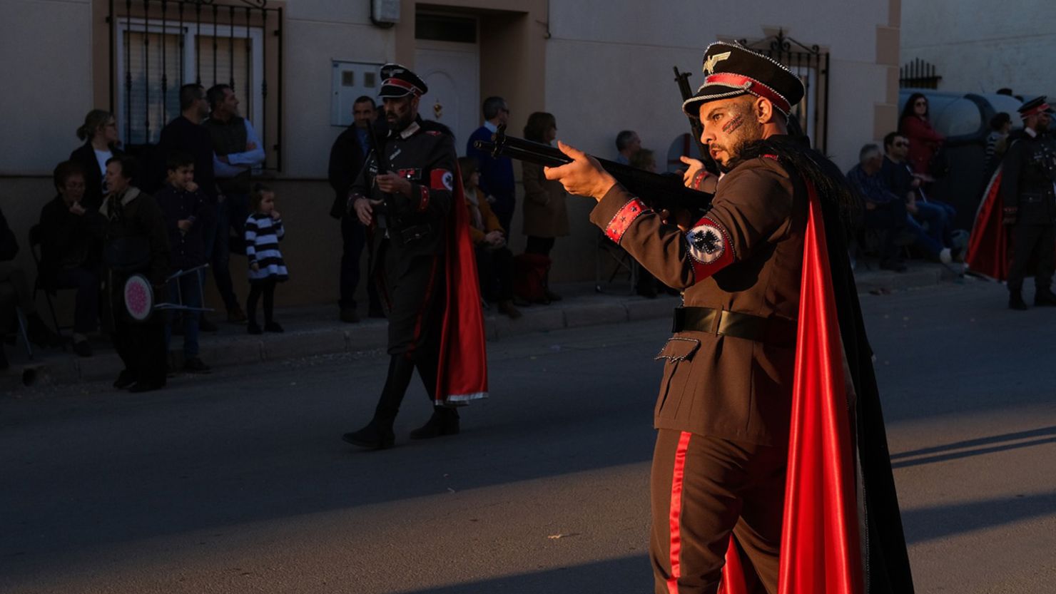 A man dressed as a Nazi soldier poses with gun at a carnival parade in Campo de Criptana, Castile-La Mancha, Spain on February 24, 2020.