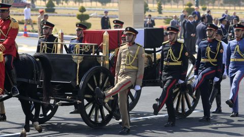 Egyptian honor guards escort the coffin during Mubarak's funeral.