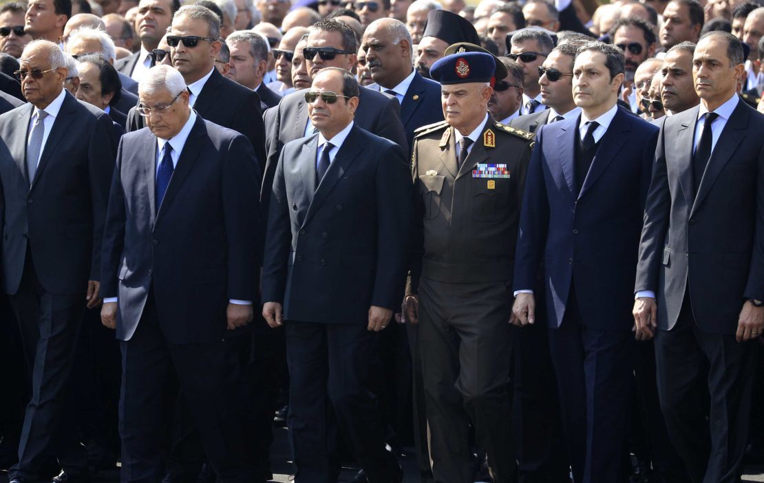 President Abdel Fattah al-Sisi, center, former interim president Adly Mansur, second left, and Mubarak's sons Alaa and Gamal attend the funeral.