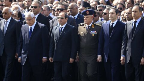 President Abdel Fattah al-Sisi, center, former interim president Adly Mansur, second left, and Mubarak's sons Alaa and Gamal attend the funeral.