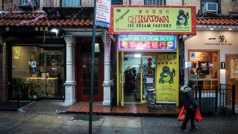 A woman walks by Chinatown Ice Cream Factory, a neighborhood fixture owned by Christina Seid and built by her father four decades ago in New York on February 13, 2020.