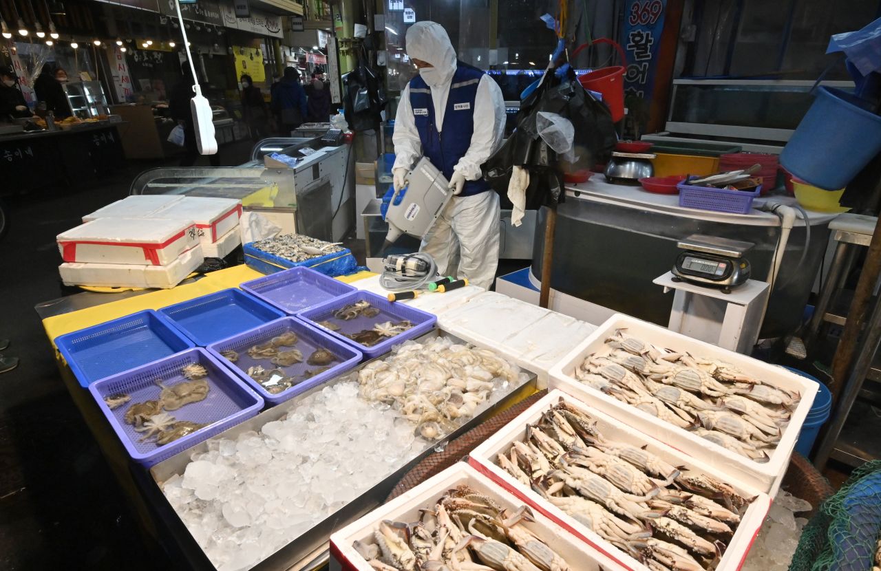A worker disinfecting a market in Seoul, South Korea, on February 24. South Korea is now the largest outbreak outside China.