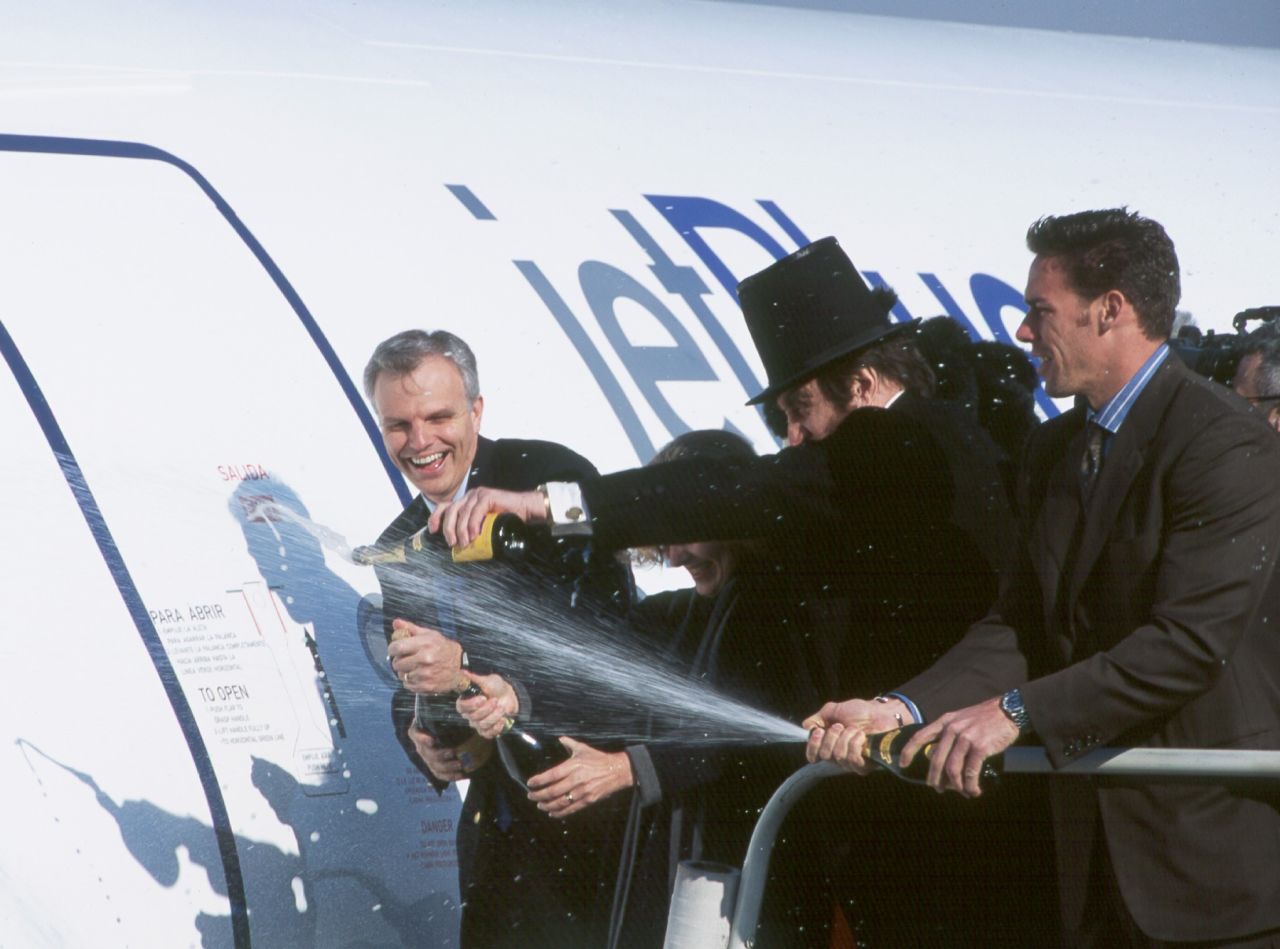 David Neeleman, founder and CEO of JetBlue, gives a Champagne christening in 2000 to Bluebird, an A320 which was the airline's first aircraft.