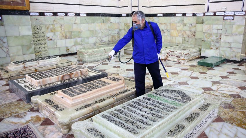 An Iranian sanitary worker disinfects Qom's Masumeh shrine on February 25, 2020 to prevent the spread of the coronavirus which reached Iran, where there were concerns the situation might be worse than officially acknowledged. - The deaths from the disease -- officially known as COVID-19 -- in the Islamic republic were the first in the Middle East and the country's toll with so far a dozen people officially reported dead, is now the highest outside mainland China, the epidemic's epicentre.