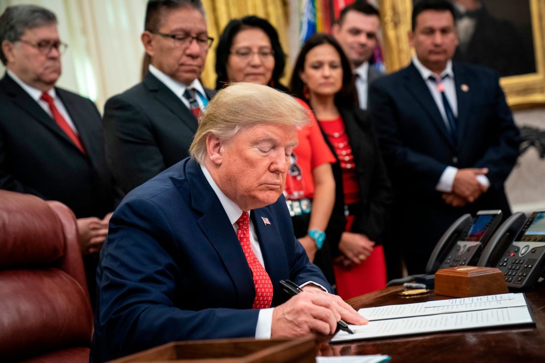 President Donald Trump signs an executive order establishing the Task Force on Missing and Murdered American Indians and Alaska Natives, last November.