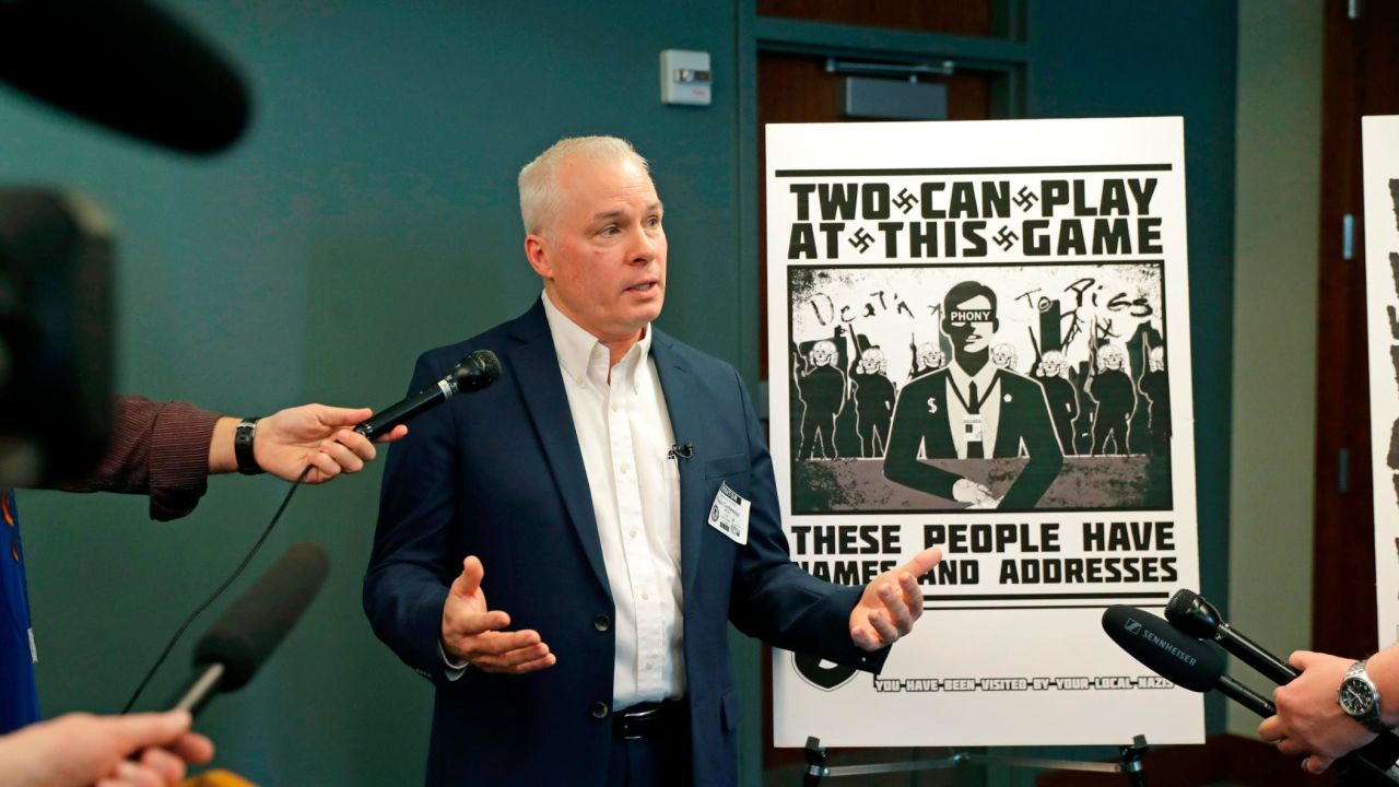 Chris Ingalls, an investigative reporter with KING-TV in Seattle, talks to reporters on Wednesday about the poster, reproduced at right, that was mailed to his home earlier this year.