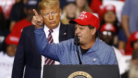 President Donald Trump listens as Mike Eruzione, captain of the 1980 U.S men's Olympic hockey team, speaks during a campaign rally, Friday, Feb. 21, 2020, in Las Vegas.