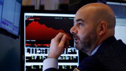 Trader Fred DeMarco works on the floor of the New York Stock Exchange, Friday, Feb. 28, 2020. Global stock markets are falling further on spreading virus fears. (AP Photo/Richard Drew)