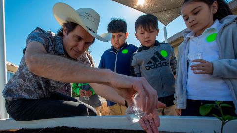Kimbal Musk teaches students how to plant a vegetable garden in California.