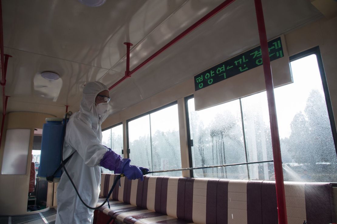 An official from the Mangyongdae District emergency anti-epidemic headquarters disinfects a tramcar to prevent the spread of the novel coronavirus, at the Songsan Tram Station in Pyongyang on February 26, 2020.