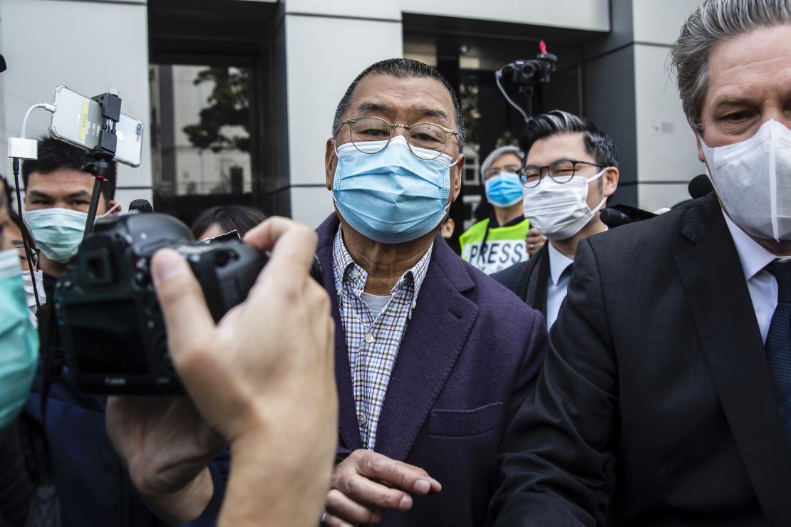 Hong Kong media tycoon and founder of Apple Daily newspaper Jimmy Lai (C) leaves the Kowloon City police station in Hong Kong on February 28, 2020, after being arrested on the suspicion of taking part in an unauthorised assembly on August 31 last year. 