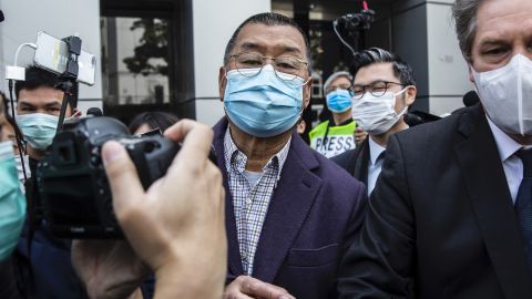 Hong Kong media tycoon and founder of Apple Daily newspaper Jimmy Lai (C) leaves the Kowloon City police station in Hong Kong on February 28, 2020, after being arrested on the suspicion of taking part in an unauthorised assembly on August 31 last year. 