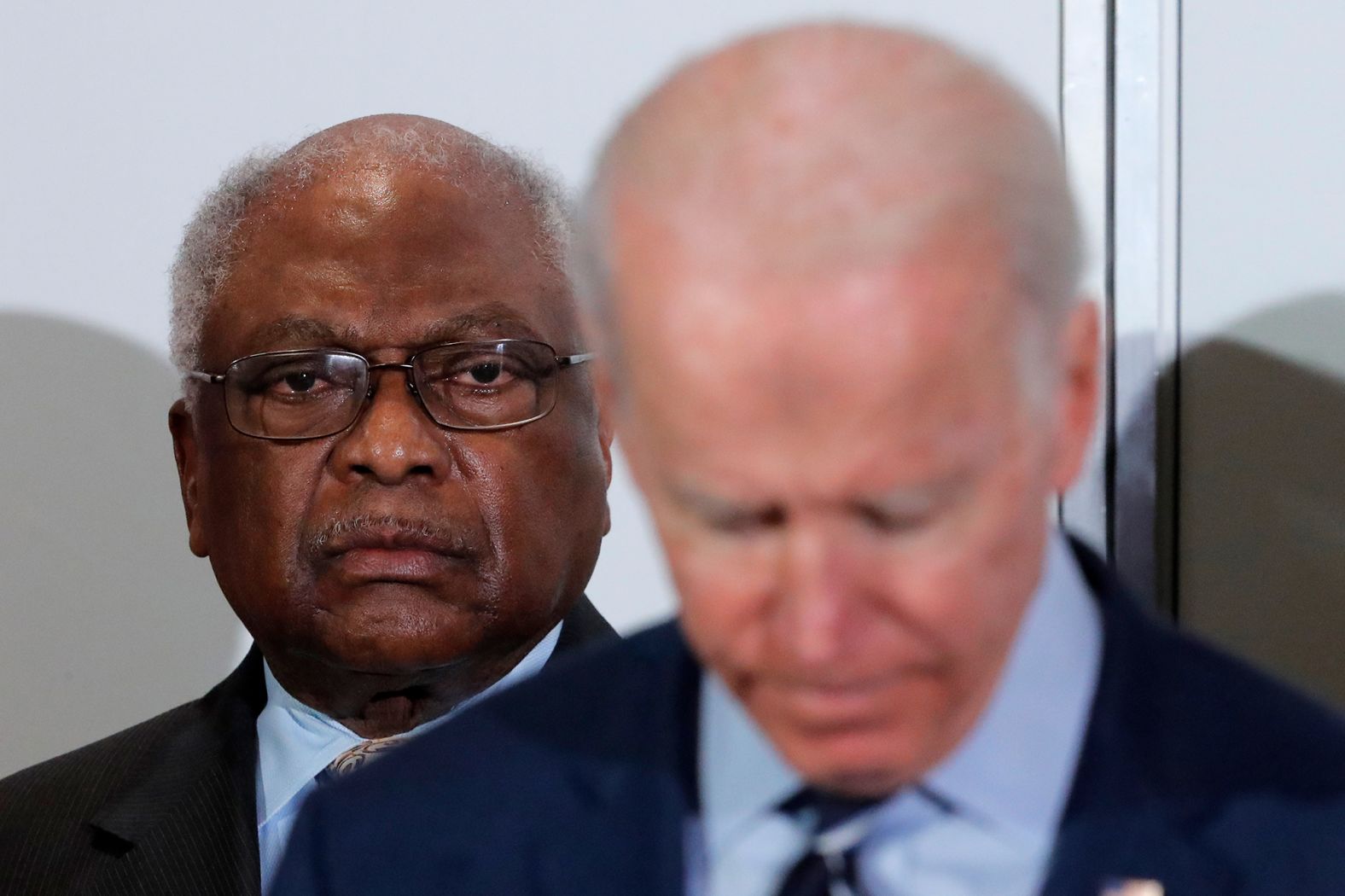 US Rep. Jim Clyburn, the House majority whip, listens as Biden speaks in North Charleston on Wednesday. Clyburn endorsed Biden during the event.