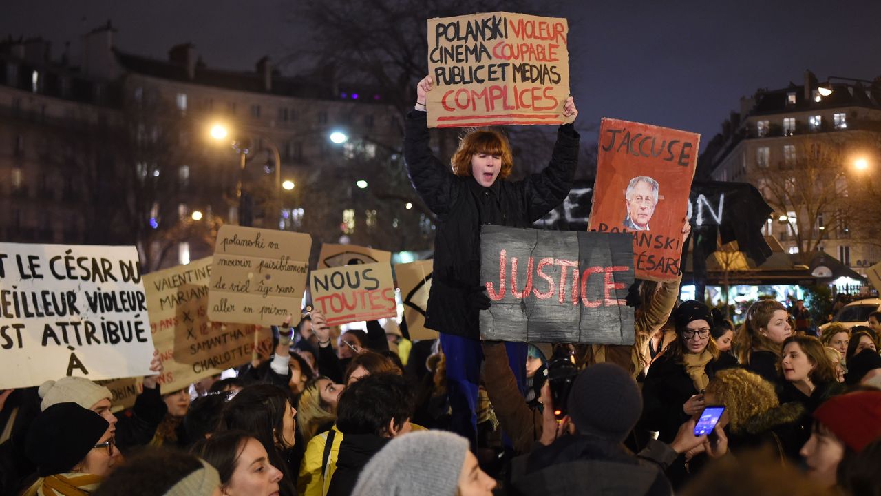 Activists gather outside the Cesar Film Awards ceremony on Friday.
