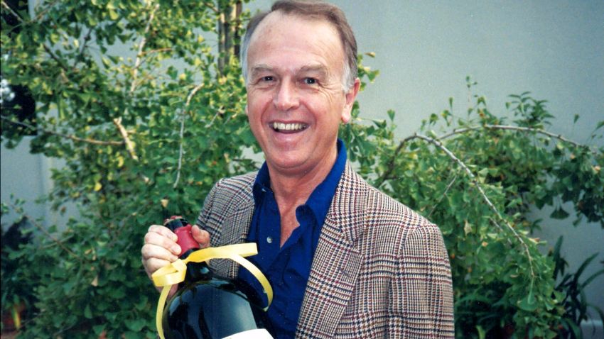 This circa 1985 photo provided by Esme Gibson shows Joe Coulombe, the founder of the Trader Joe's market chain, at his home in Pasadena, Calif. Coulombe, the man who created Trader Joe's markets with a vision that college-educated but poorly paid young people would buy healthy foods if they could only afford them, has died. Coulombe's family says he died Friday, Feb. 28, 2020 at age 89. He opened the first of his quirky, nautically themed markets in Pasadena, California, in 1967. He stocked it with granola, organic foods and other items he bought directly from suppliers to hold prices down. Trader Joe's now has more than 500 stores in over 40 states. (Image by Esme via AP)