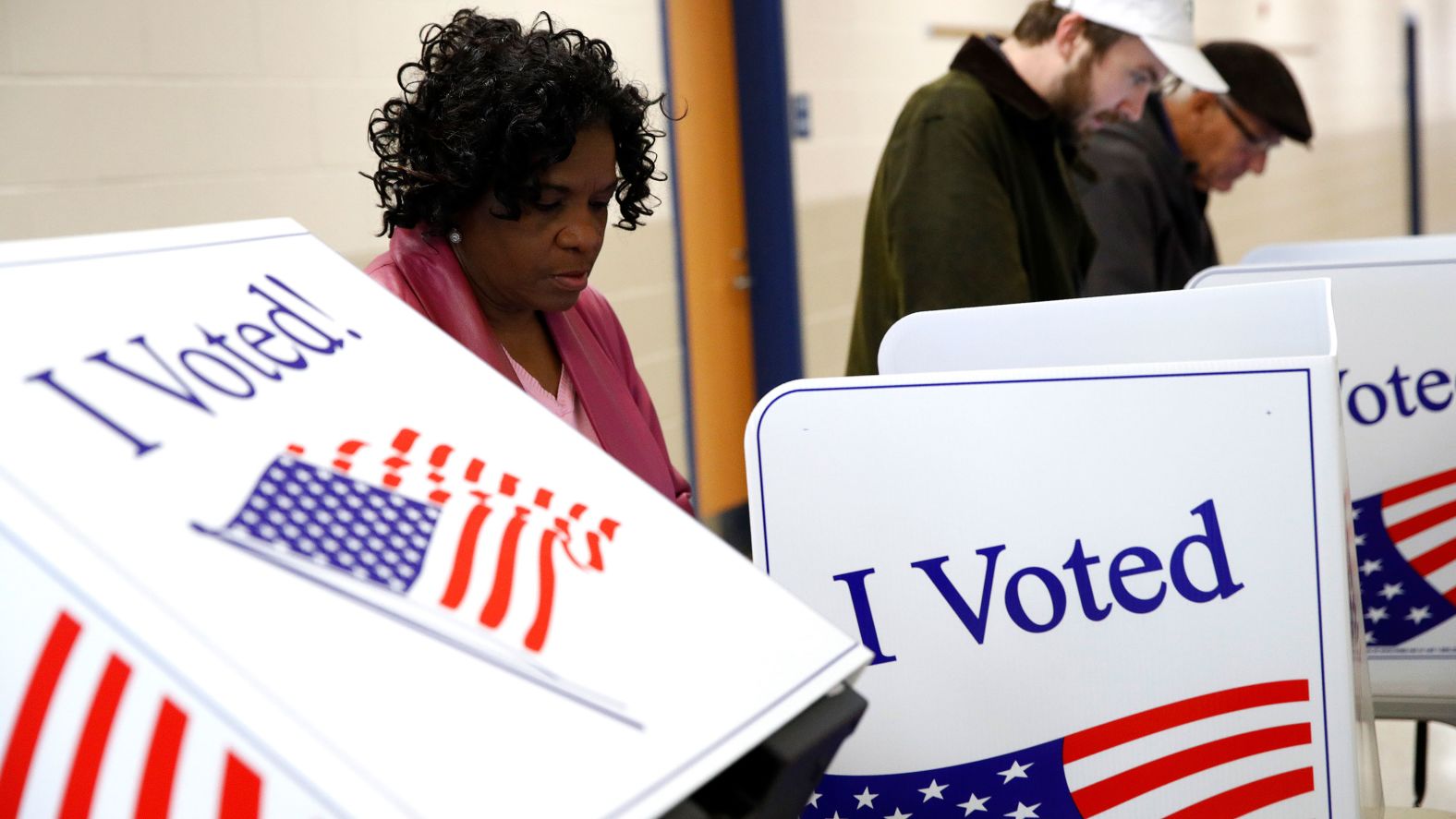 Voters fill out their ballots at a polling place in Charleston.