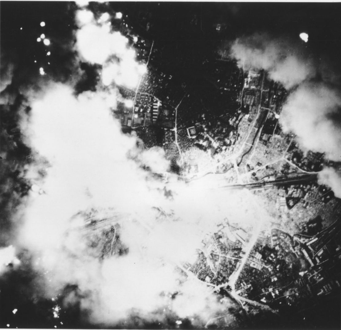 Smoke and fire rise from Tokyo during the US firebomb raid.