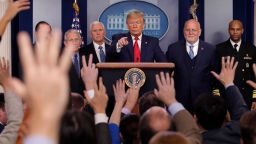 President Donald Trump, center, points as he prepares to answer question after speaking about the coronavirus in the press briefing room at the White House, Saturday, Feb. 29, 2020, in Washington as Health and Human Services Secretary Alex Azar, National Institute for Allergy and Infectious Diseases Director Dr. Anthony Fauci, Vice President Mike Pence, Robert Redfield, director of the Centers for Disease Control and Prevention and U.S. Surgeon General Dr. Jerome Adams listen. (AP Photo/Carolyn Kaster)