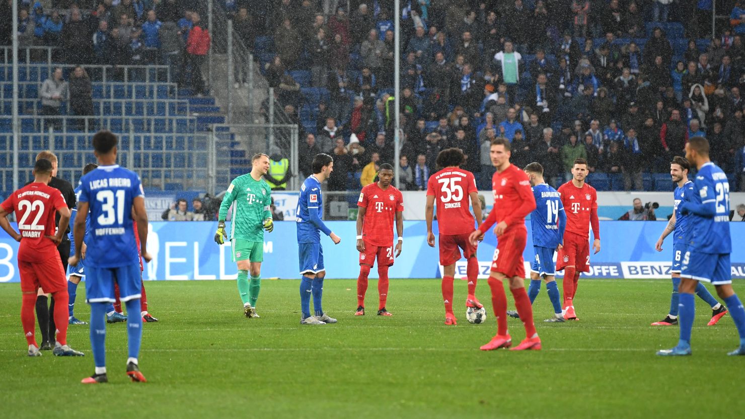 Bayern and Hoffenheim players play out the final few minutes, passing the ball between each other. 