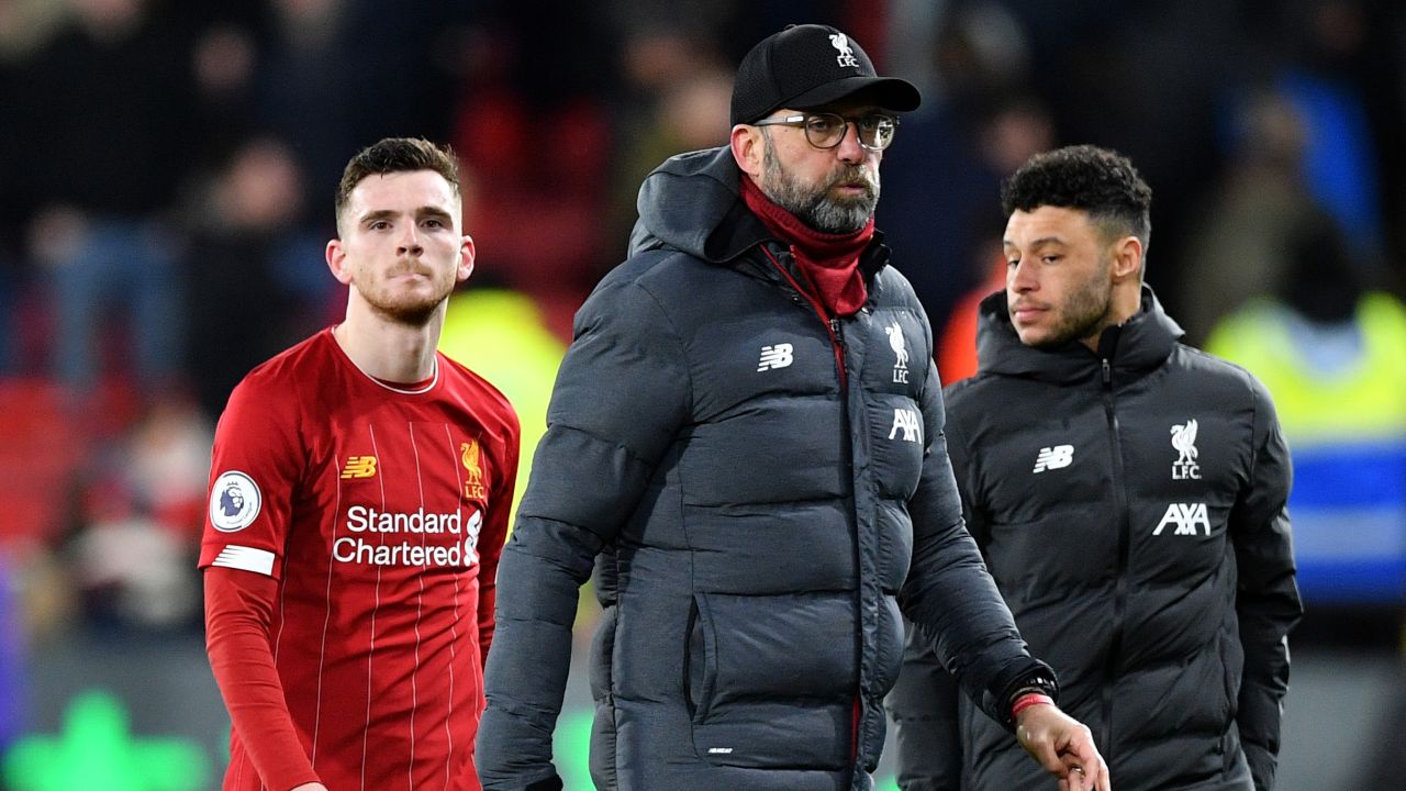 Klopp puffs his cheeks following the defeat to Watford.