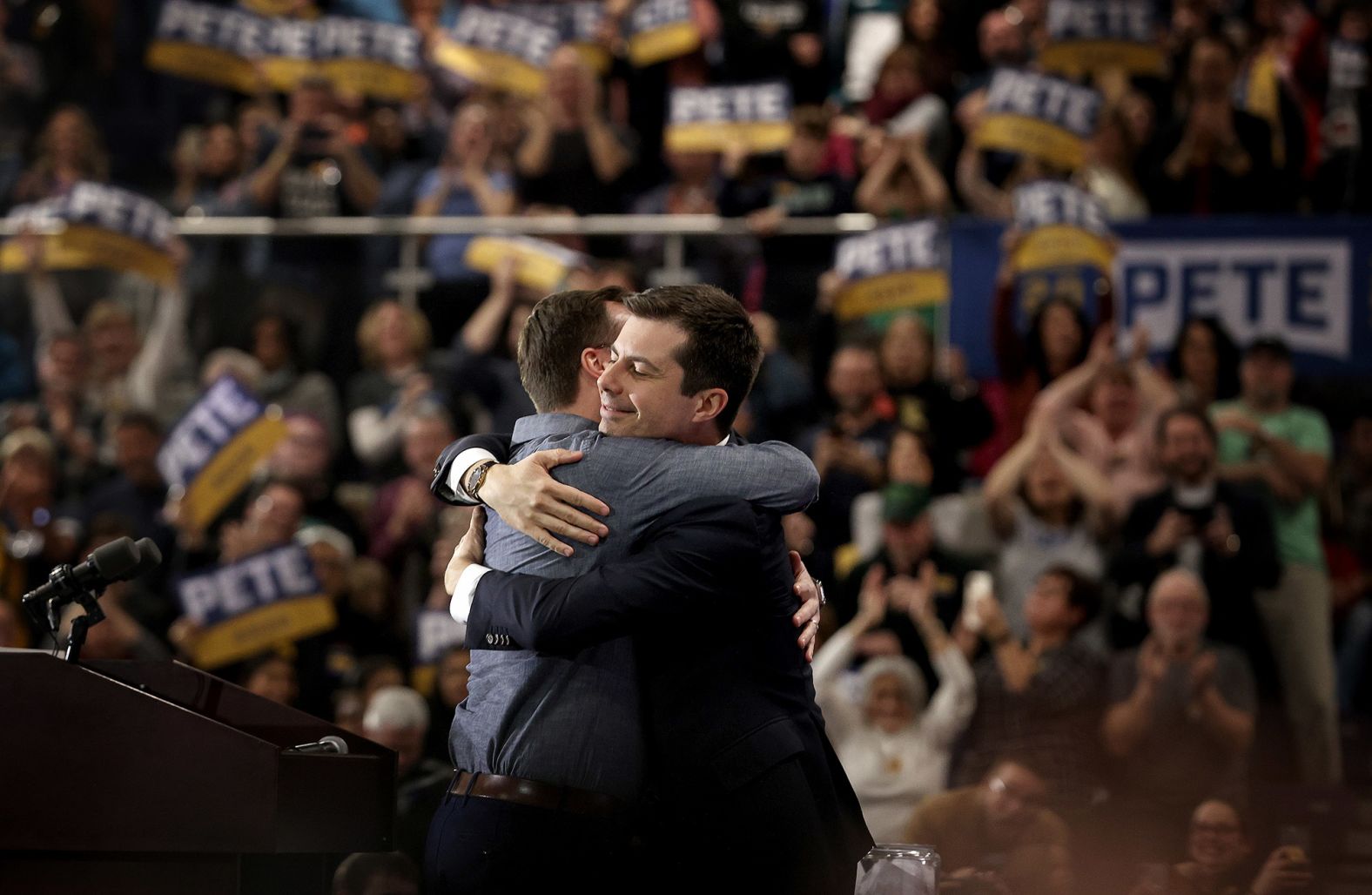 Pete Buttigieg, the former mayor of South Bend, Indiana, hugs his husband, Chasten, at a rally in Raleigh, North Carolina, on Saturday night.