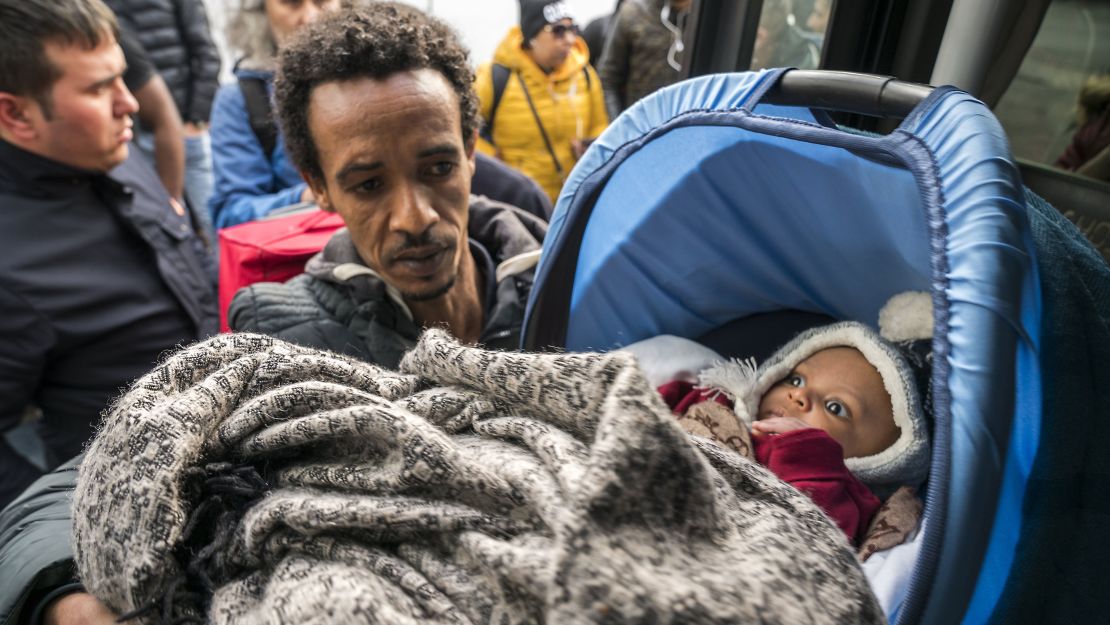 Refugees in Turkey board buses headed to the border with Greece, on Saturday.