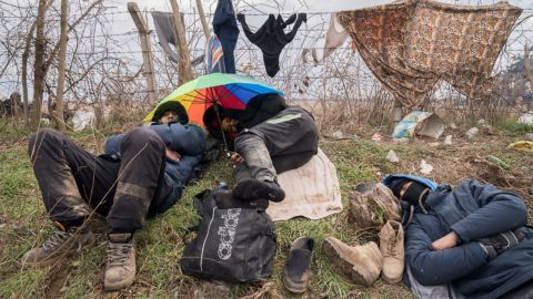 Migrants bunker down in miserable conditions at the Pazarkule Border post.