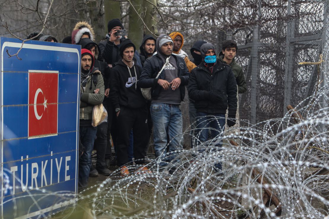 Migrants gather at Pazarkule border as they attempt to enter Greece from Turkey on February 29.
