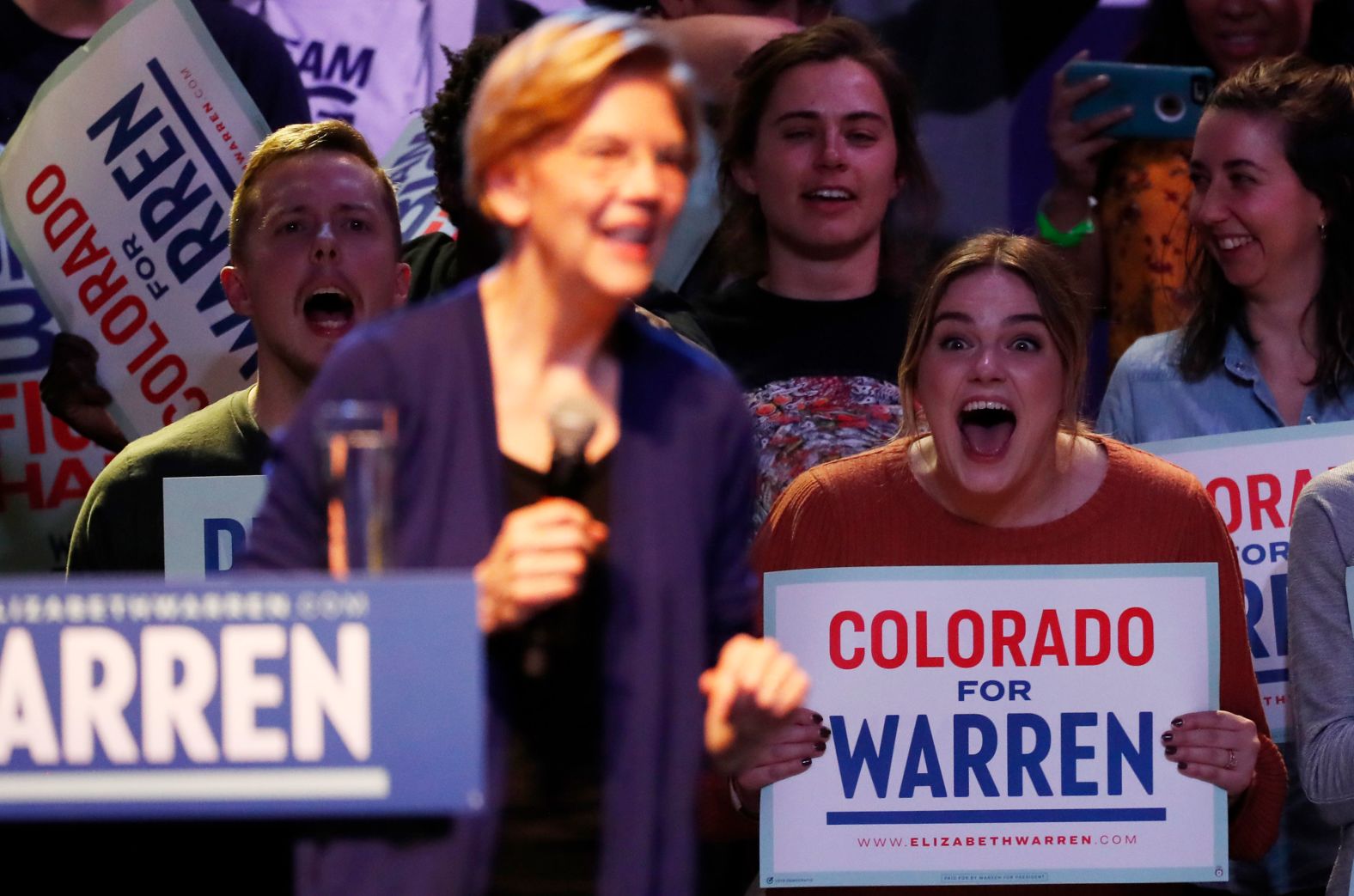 Warren supporters react during her rally in Denver on Sunday.