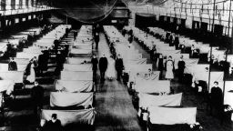 Image shows warehouses that were converted to keep the infected people quarantined. The patients are suffering from the 1918 Influenza pandemic, a total of 50-100 million people were killed. 