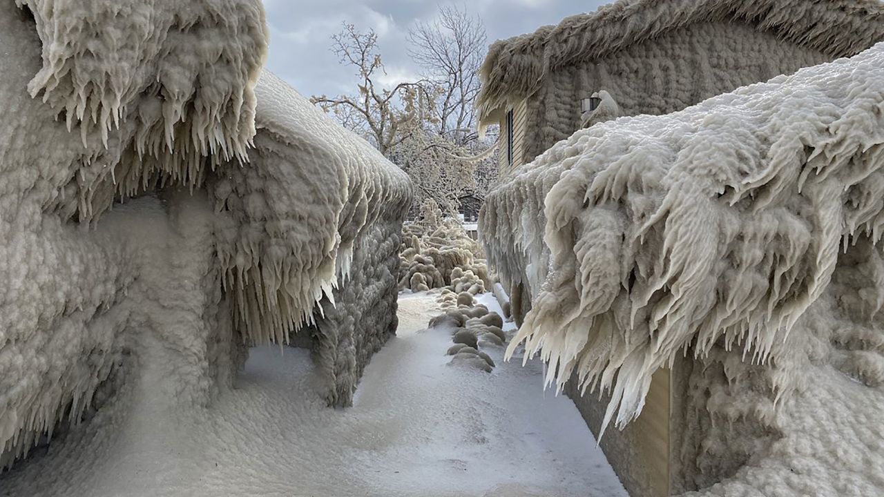 Ice completely coats the outside of the homes.