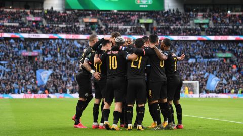 Manchester City players celebrate the first goal scored by Aguero.