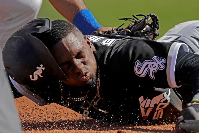 Chicago White Sox outfielder Luis Roberts slides in to third base during the second inning of a spring training game against the Texas Rangers in Surprise, Arizona, on February 29.