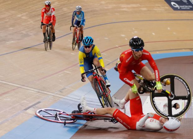 China's Wang Xiaofei crashes over Poland's Daria Pikulik during the women's 30km Madison final at the UCI track cycling World Championship in Berlin on February 29.