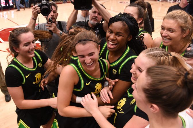 Oregon Ducks guard Sabrina Ionescu, center, celebrates with teammates after the NCAA women's basketball game against the Stanford Cardinals at Maples Pavilion in Palo Alto, California, on February 24. <a href="index.php?page=&url=https%3A%2F%2Fwww.cnn.com%2F2020%2F02%2F25%2Fus%2Fsabrina-ionescu-makes-ncaa-history-in-win-at-stanford-spt-trnd%2Findex.html" target="_blank">Ionescu made history</a> by becoming the first college basketball player -- male or female -- to have 2,000 points, 1,000 assists and 1,000 rebounds in her career.