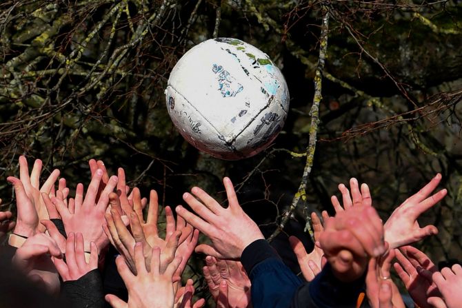 Competitors from the opposing teams, the Up'ards and the Down'ards, reach for the ball during the annual Royal Shrovetide Football Match in Ashbourne, northern England, on February 25. The mass-participation ball game has very few rules, is played over two 8-hour periods on Shrove Tuesday and Ash Wednesday and is believed to have been played annually in Ashbourne since 1667.