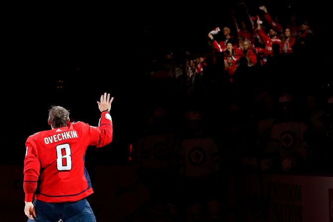 Washington Capitals left wing Alex Ovechkin waves to the crowd during a ceremony honoring his <a href="index.php?page=&url=https%3A%2F%2Fwww.cnn.com%2F2020%2F02%2F22%2Fus%2Falex-ovechkin-700-goal%2Findex.html" target="_blank">700th NHL goal</a> prior to the Capitals' game against the Winnipeg Jets at Capital One Arena on February 25.