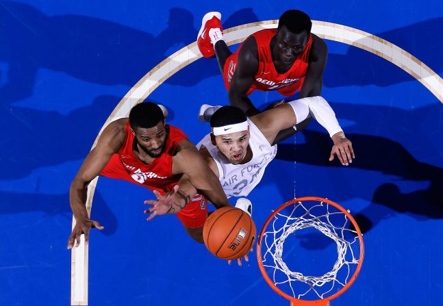 New Mexico Lobos' JaQuan Lyle and Air Force Falcons' Ryan Swan battle for a rebound during the February 26 game at Clune Arena in Colorado Springs.