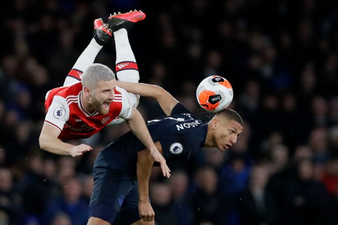Arsenal's Shkodran Mustafi and Everton's Richarlison fight for the ball during an English Premier League match in London on February 23.